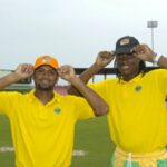 Assad Fudadin and Steven Jacobs show off their Super Caps Randy Brooks photo