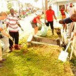 U.S. Ambassador D. Brent Hardt with volunteers cleaning up Georgetown