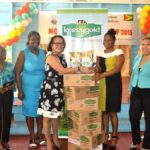 Mrs. Sandra Granger hands Over the Milk, Courtesy of DeSinco Trading Ltd, to the Administrator of the Palms, Samantha Douglas