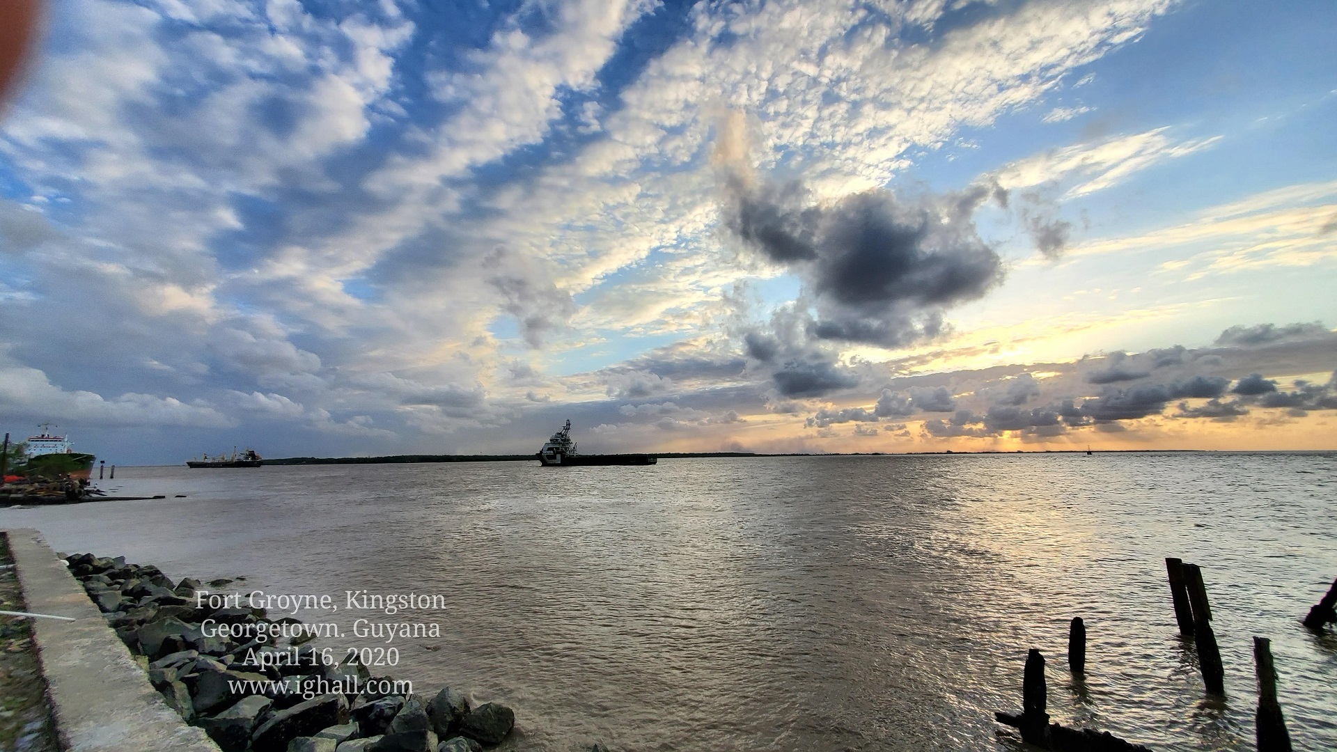 Standing at Fort Groyne, mouth of the Demerara River